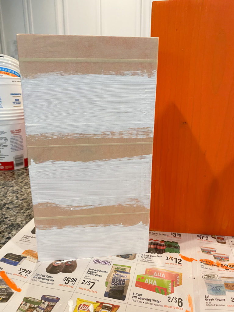 To show how to tape off the wood block to make stripes. 