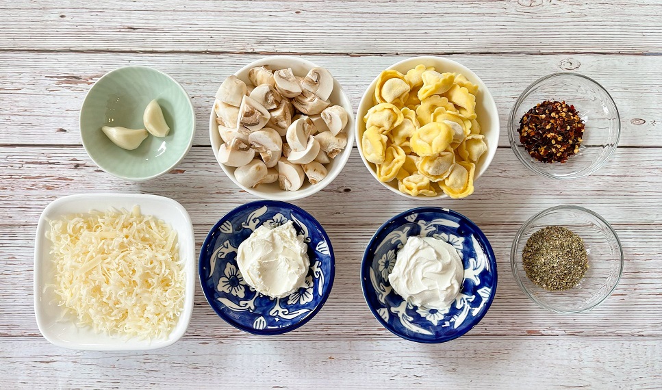 Ingredients for cheese tortelloni in a creamy mushroom sauce.